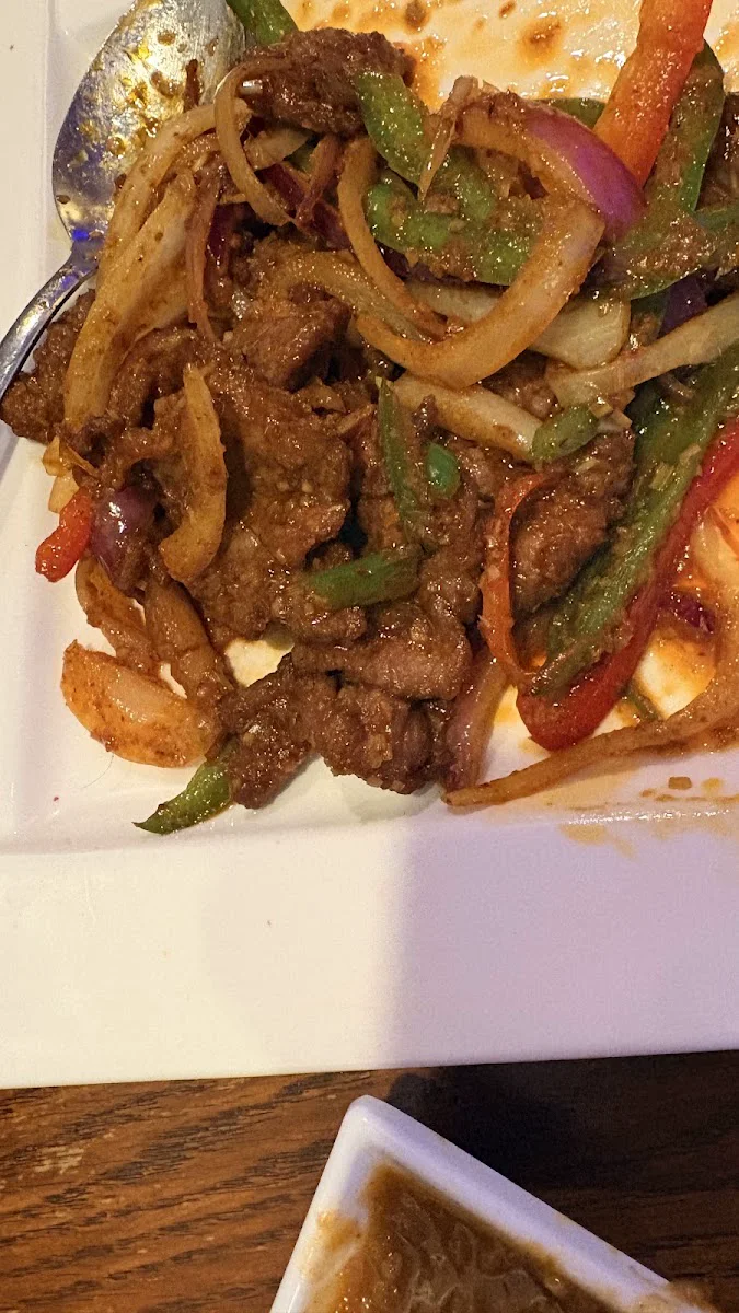 Stir-fried beef strips, peppers and onions