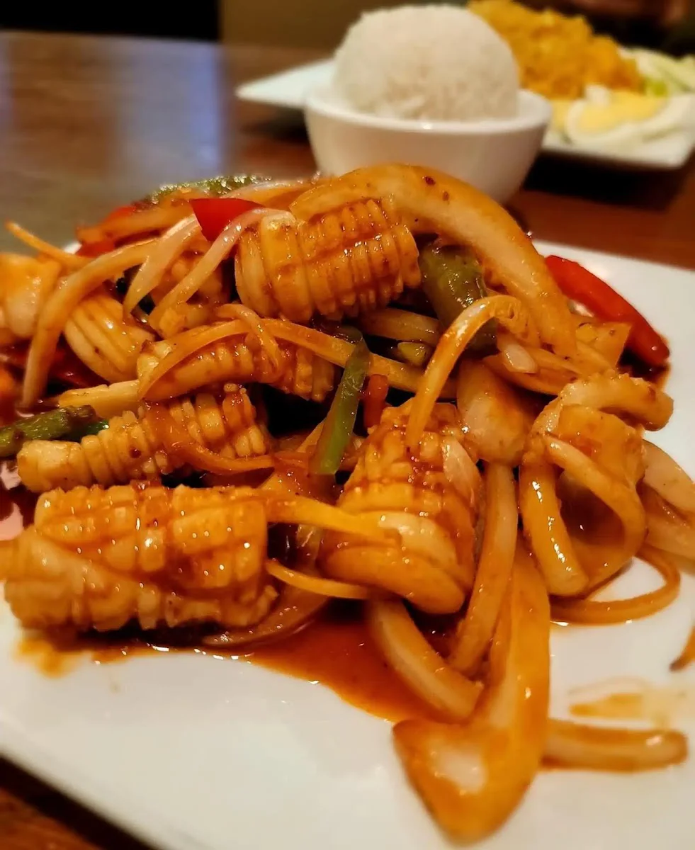 Stir-fried noodles with vegetables and a side of white rice